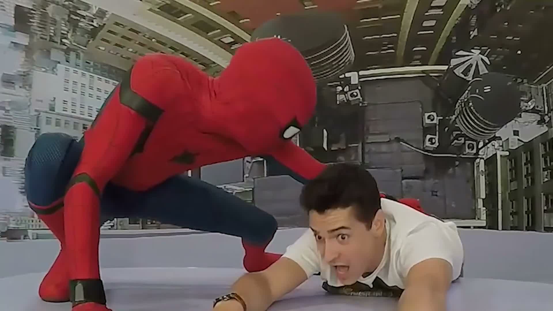 A fan crouching beside Spider-Man inside a comic-book scene, shot by an OrcaVue 360 photo booth